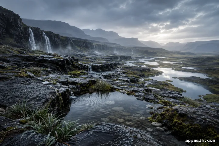 Elevated view across a rain-soaked basalt valley with layered volcanic terraces, detailed wet grasses, reflective pools, winding runoff streams, distant waterfalls, luminous mist, and charcoal-blue mountain ridges.